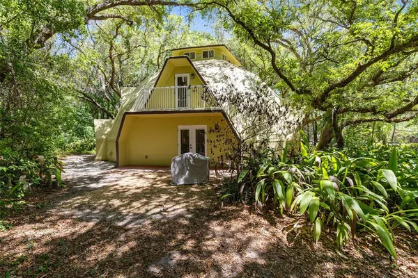 a aerial view of a house with a yard