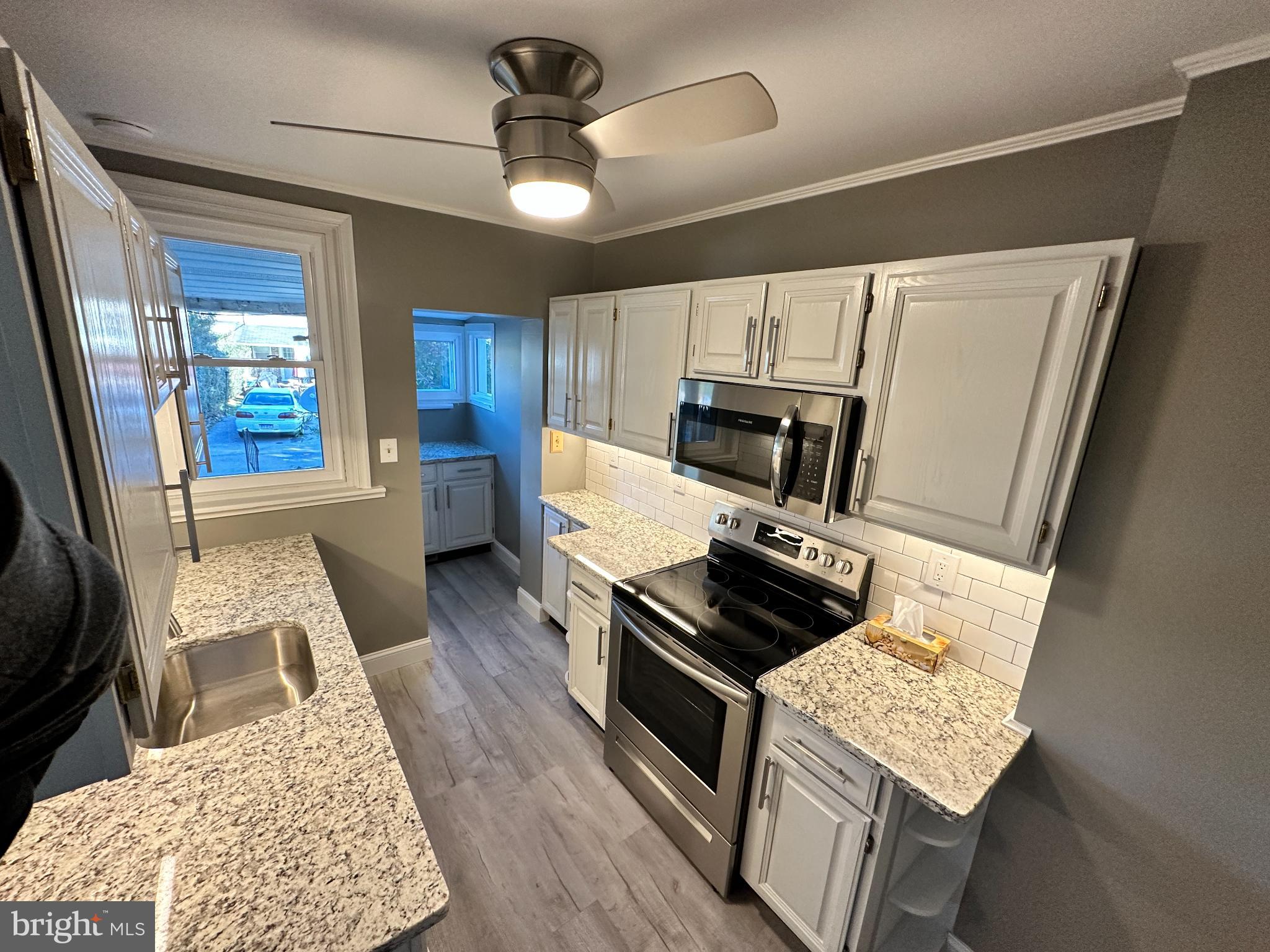 389 Oak Terrace Reading, PA 19611 - Photo 3 of 15 a kitchen with a stove a refrigerator and a stove