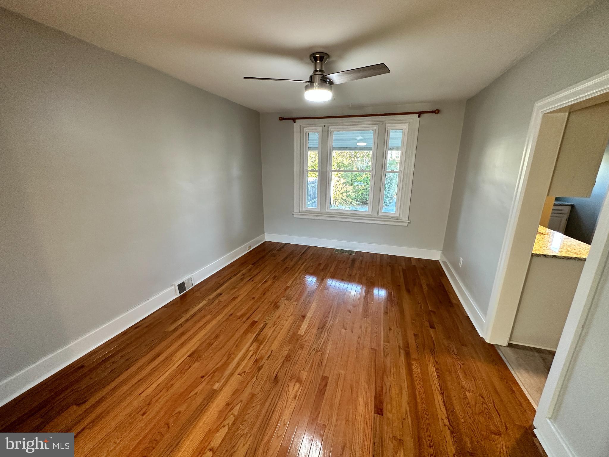 389 Oak Terrace Reading, PA 19611 - Photo 6 of 15 wooden floor in an empty room with a window