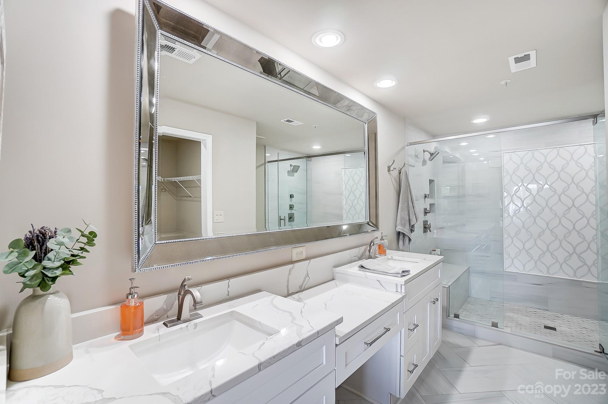 1230 Torrence Circle Davidson, NC 28036 - Photo 14 of 23 a bathroom with a tub sink and mirror