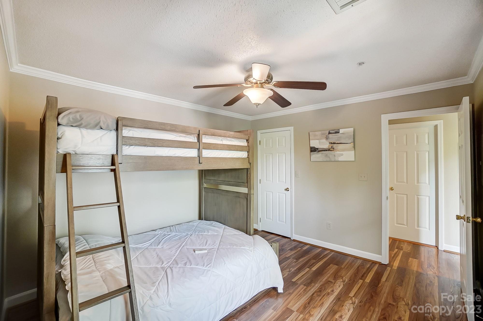 1230 Torrence Circle Davidson, NC 28036 - Photo 18 of 23 a view of empty room with wooden floor and fan