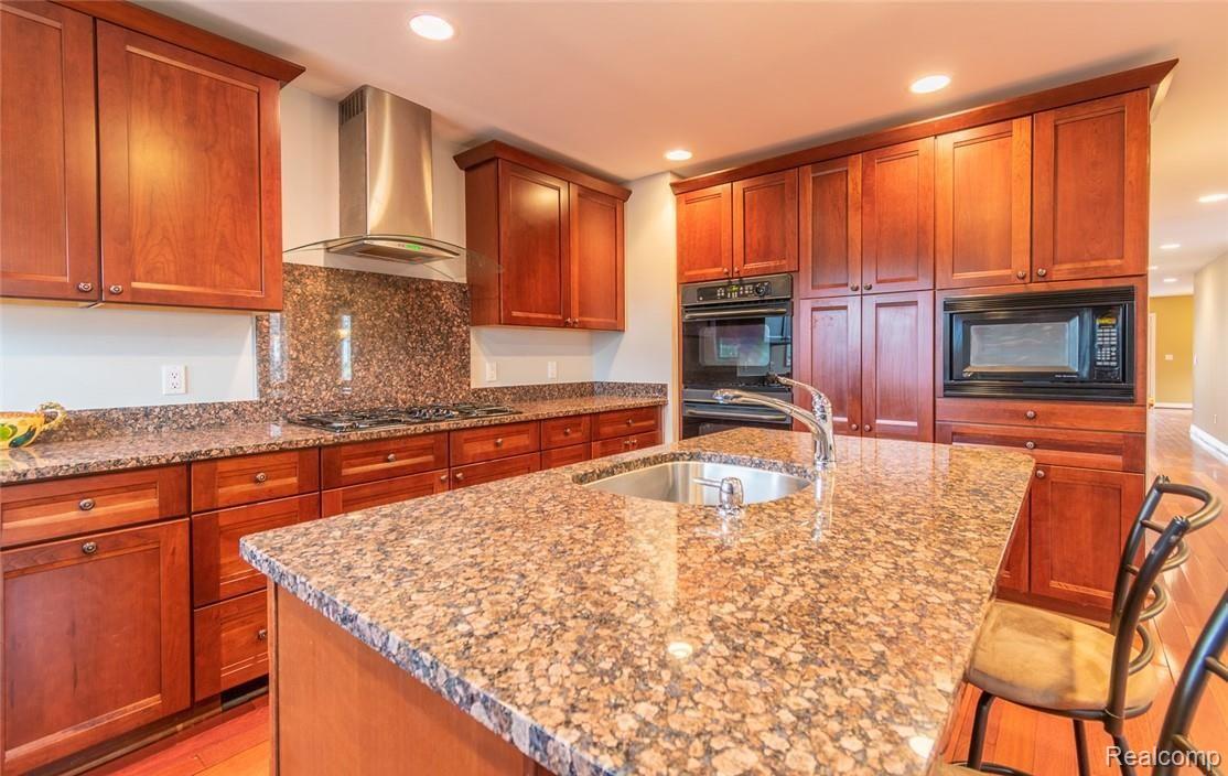 31501 Evergreen Road Franklin, MI 48025 - Photo 16 of 52 Granite counters and stainless hood vent