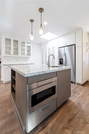 a stove top oven sitting inside of a kitchen