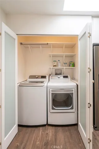 a view of a livingroom with furniture and wooden floor