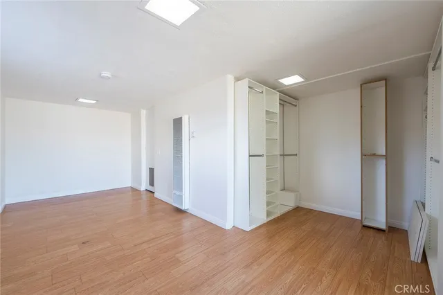a view of a house with a yard covered with snow in the background