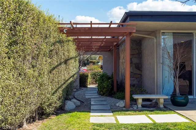 a lobby with furniture and potted plants