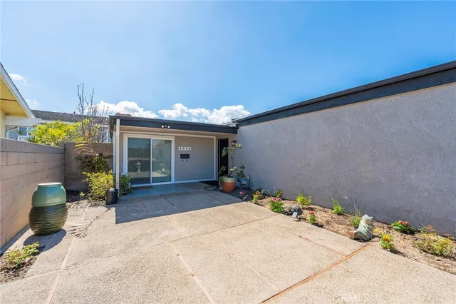 a view of a chairs and table in backyard