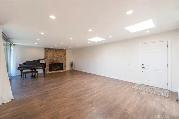 a view of work space with wooden floor and furniture