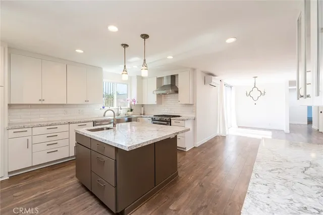 a kitchen with a sink stove and cabinets