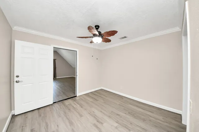 a view of a house with backyard and porch