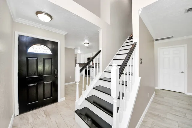 a kitchen with granite countertop a stove and a sink