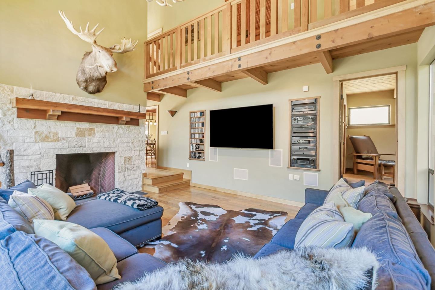 855 Oak Ridge Road Los Gatos, CA 95033 - Photo 11 of 73 a living room with furniture a flat screen tv and a fireplace