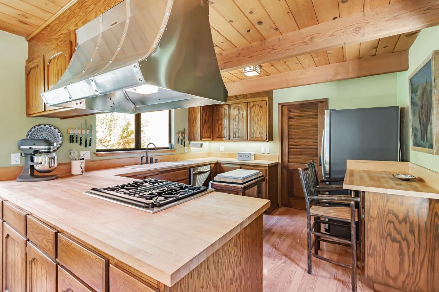 855 Oak Ridge Road Los Gatos, CA 95033 - Photo 14 of 73 a kitchen with a stove and a table