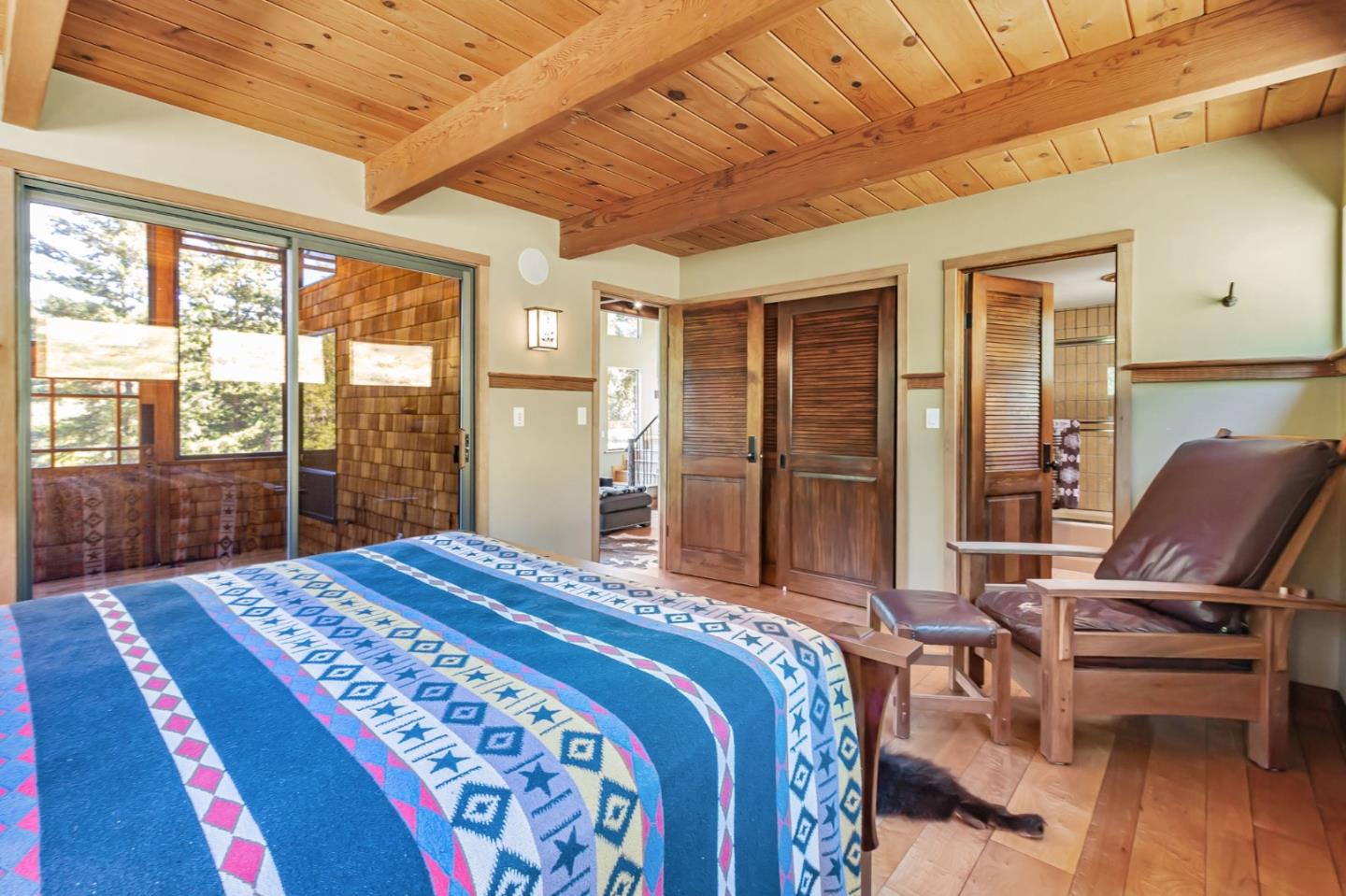 855 Oak Ridge Road Los Gatos, CA 95033 - Photo 31 of 73 a bedroom with a bed and wooden floor