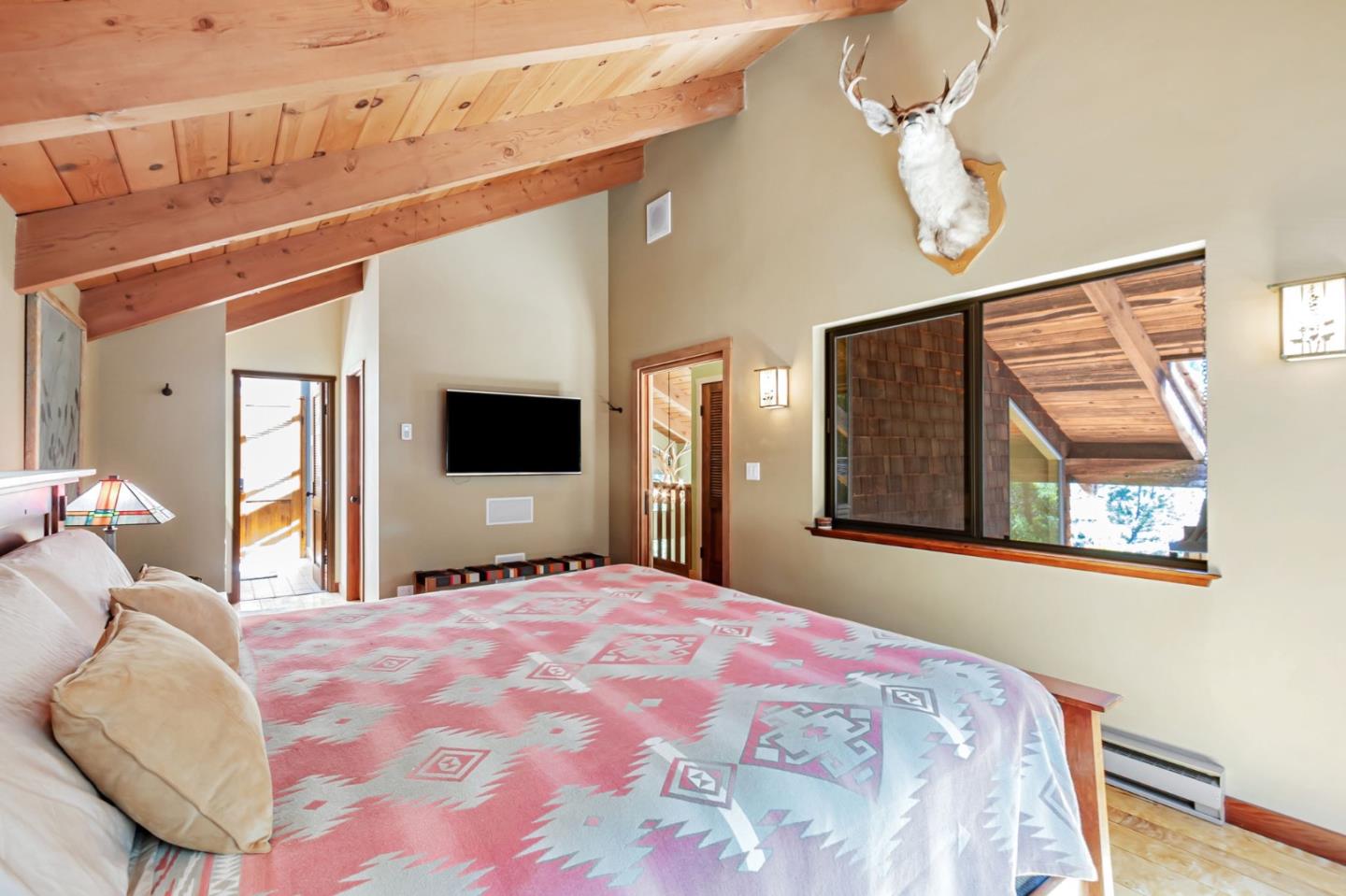 855 Oak Ridge Road Los Gatos, CA 95033 - Photo 36 of 73 a bedroom with a bed and a flat screen tv