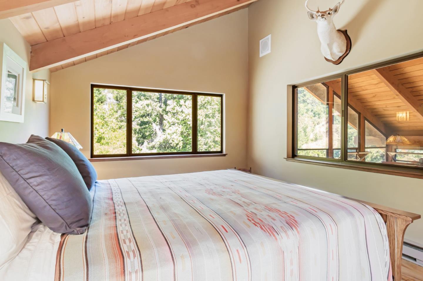 855 Oak Ridge Road Los Gatos, CA 95033 - Photo 38 of 73 a bed sitting in a bedroom next to a window