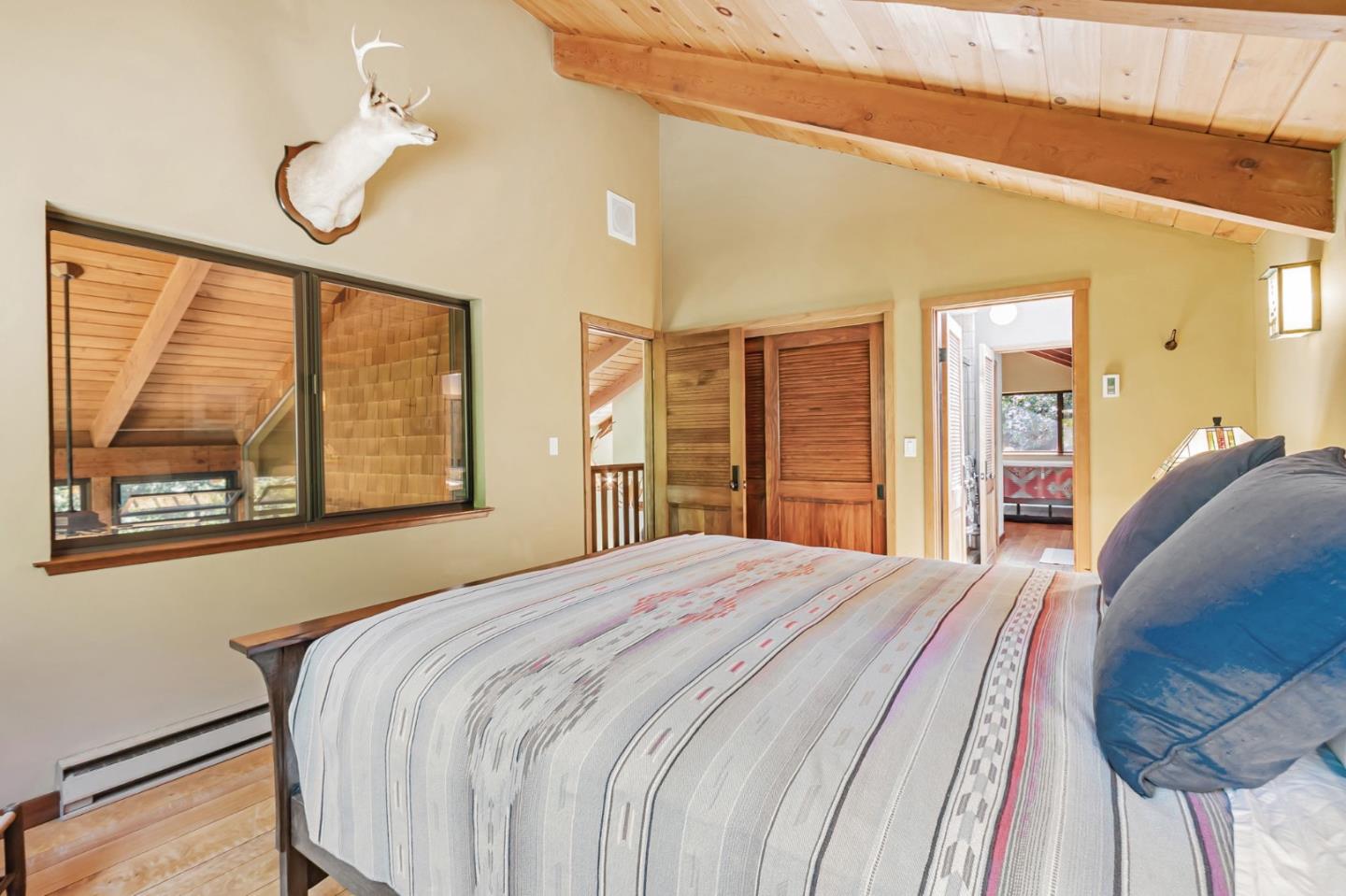 855 Oak Ridge Road Los Gatos, CA 95033 - Photo 39 of 73 a bedroom with a large bed and a window