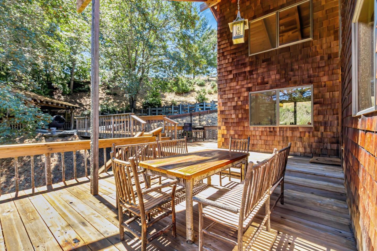 855 Oak Ridge Road Los Gatos, CA 95033 - Photo 7 of 73 a view of a patio with table and chairs with wooden floor and fence
