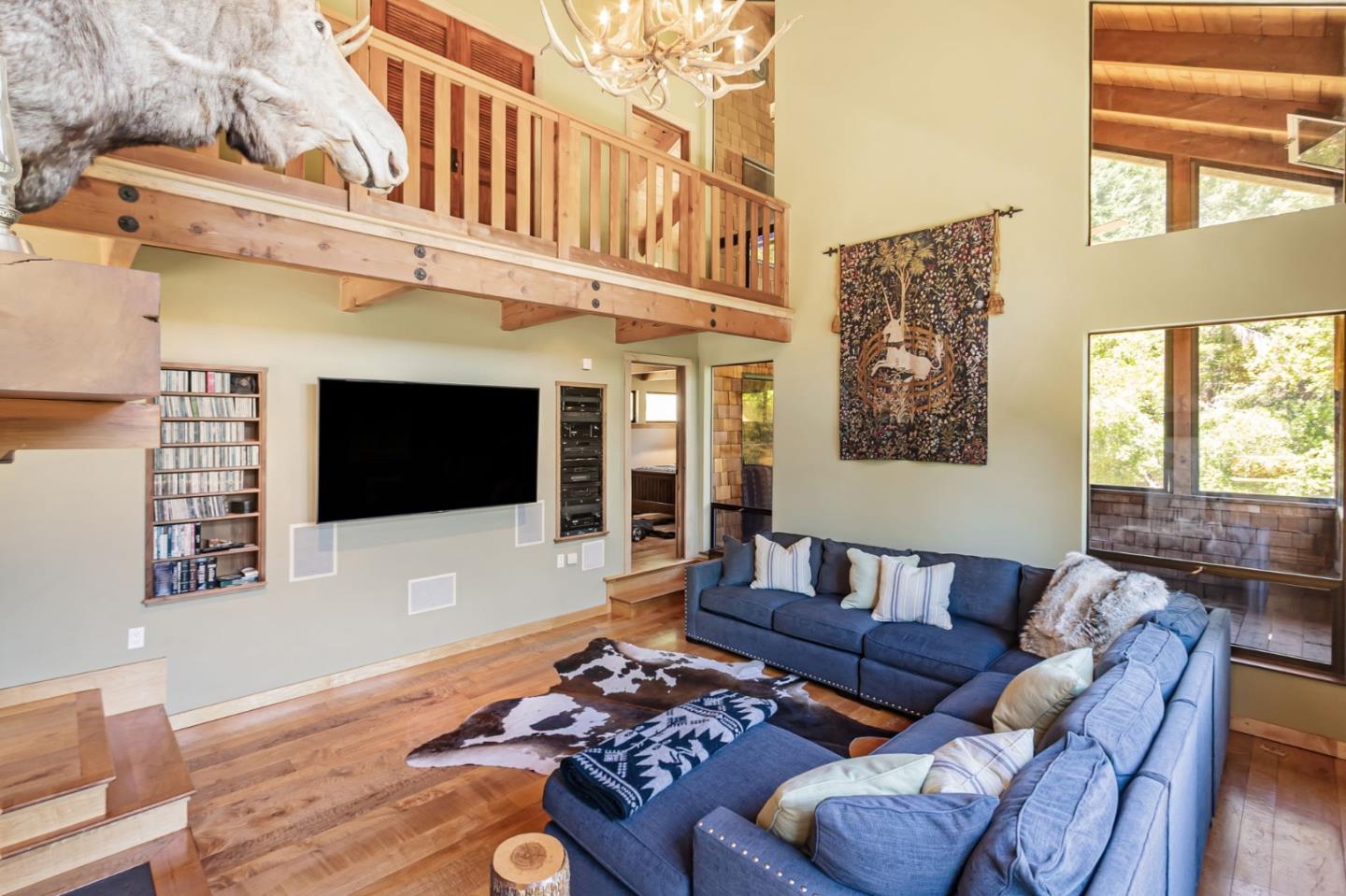 855 Oak Ridge Road Los Gatos, CA 95033 - Photo 10 of 73 a living room with furniture a flat screen tv and a fireplace