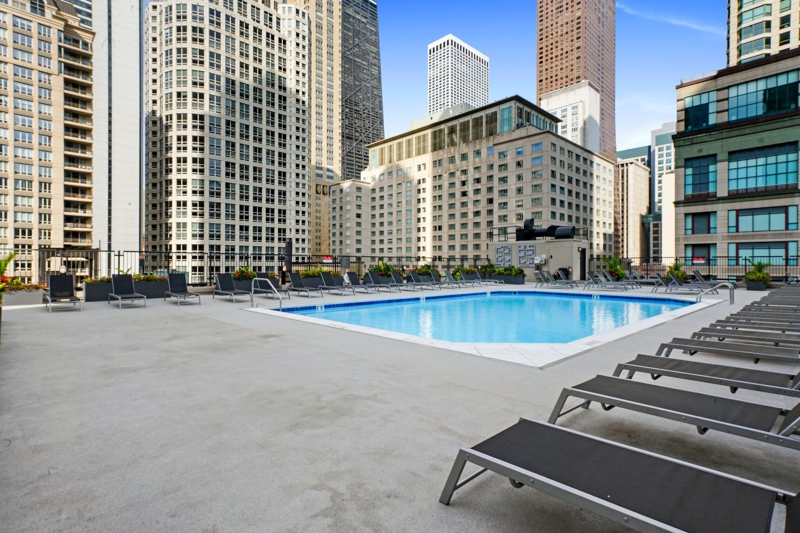 30 East Huron Street, Unit 1904 Chicago, IL 60611 - Photo 24 of 24 an outdoor view of building with swimming pool