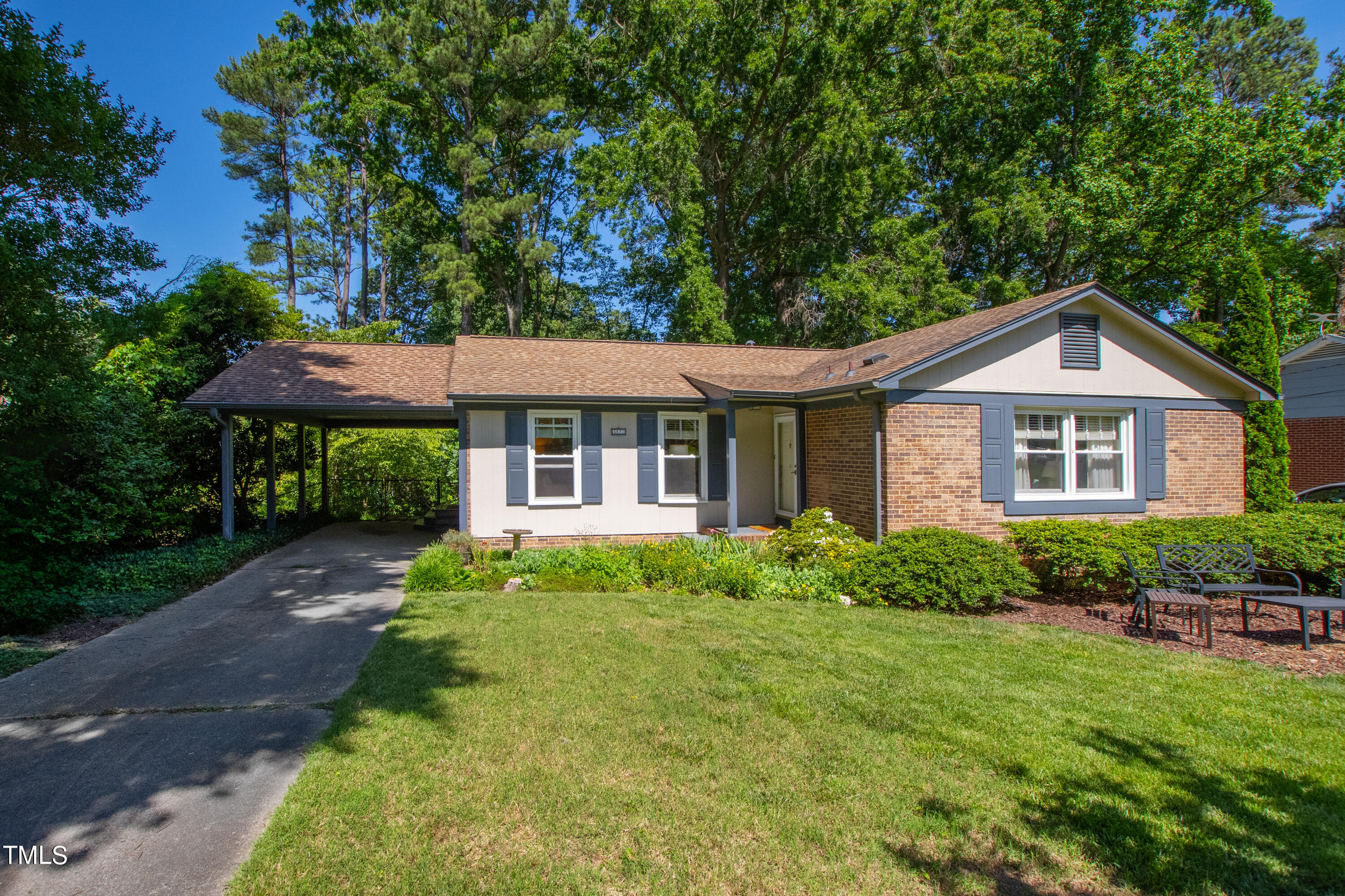 4832 Latimer Road Raleigh, NC 27609 - Photo 1 of 47 a front view of a house with a yard