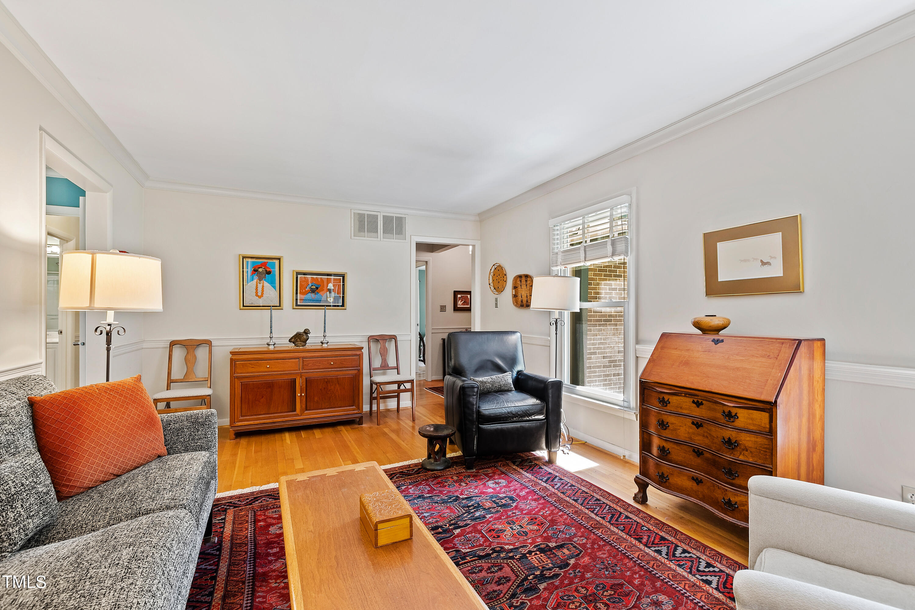 4832 Latimer Road Raleigh, NC 27609 - Photo 14 of 47 a living room with furniture and a couch