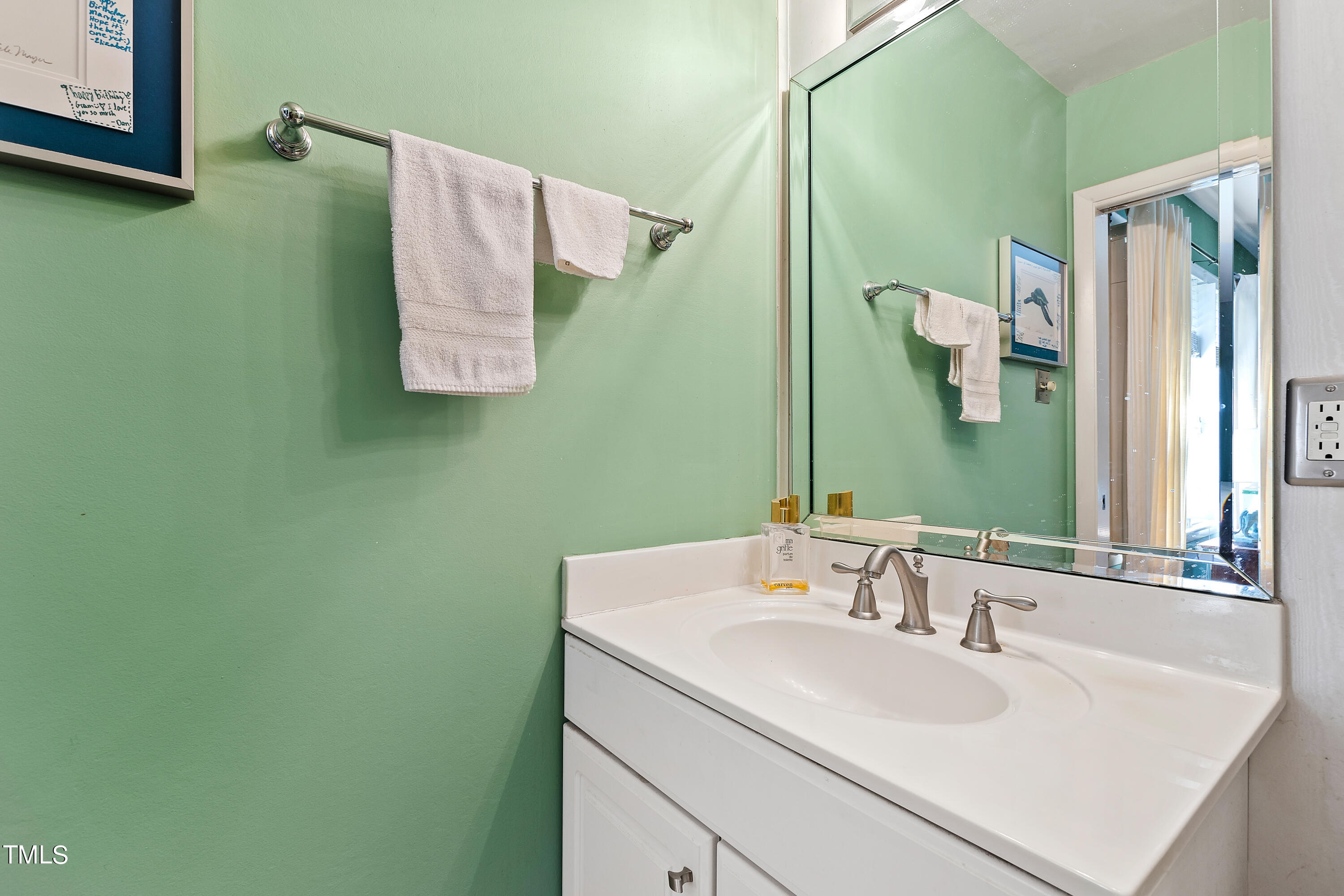 4832 Latimer Road Raleigh, NC 27609 - Photo 27 of 47 a bathroom with a sink and a mirror