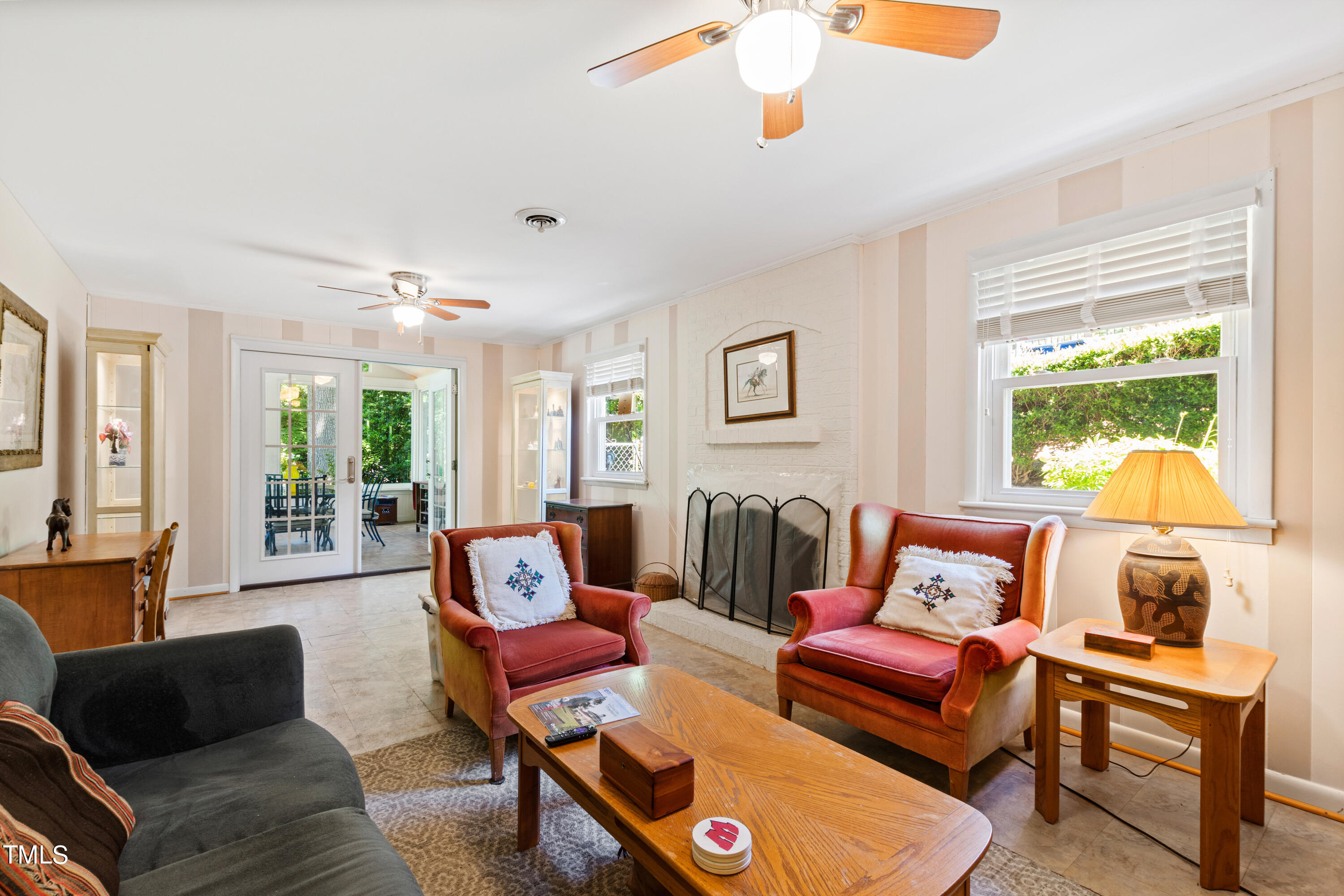 4832 Latimer Road Raleigh, NC 27609 - Photo 35 of 47 a living room with furniture and a large window