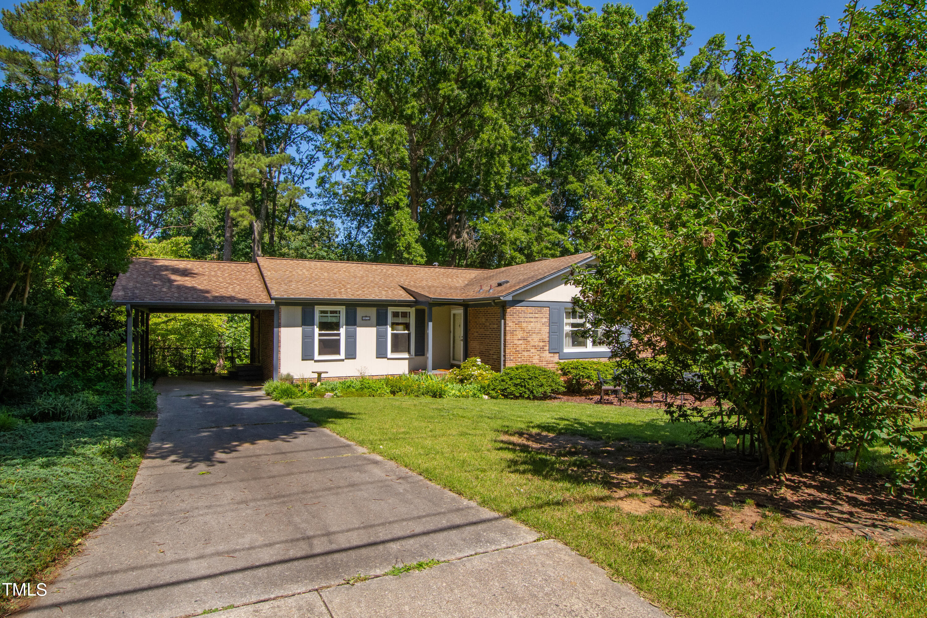 4832 Latimer Road Raleigh, NC 27609 - Photo 7 of 47 a front view of a house with a garden