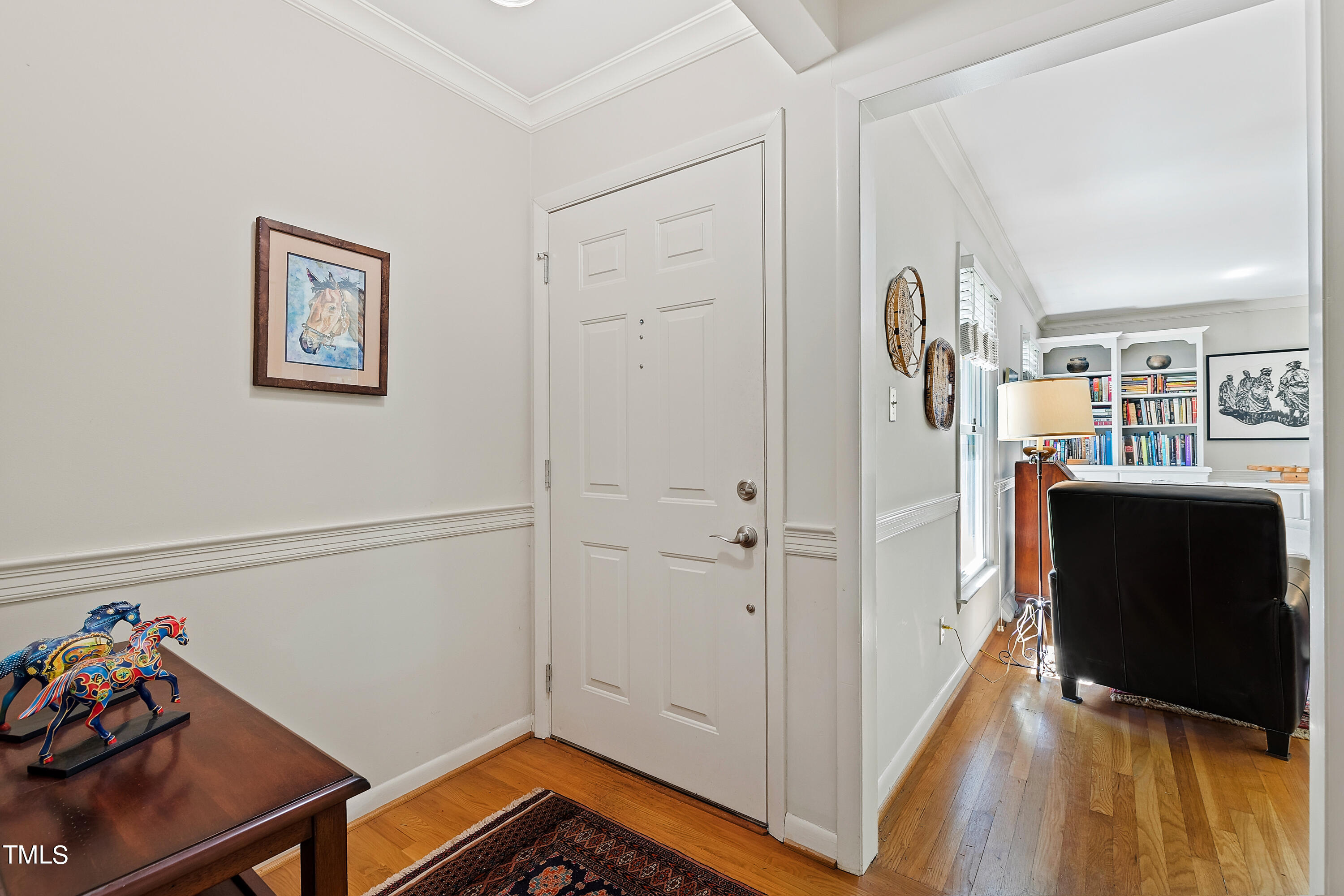 4832 Latimer Road Raleigh, NC 27609 - Photo 10 of 47 a view of a hallway with workspace and wooden floor