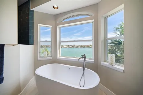 a room with a chair and a large window