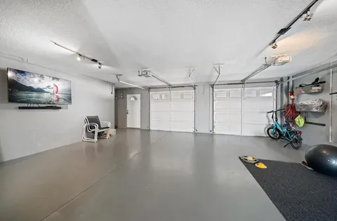 a view of a swimming pool with a table and chairs