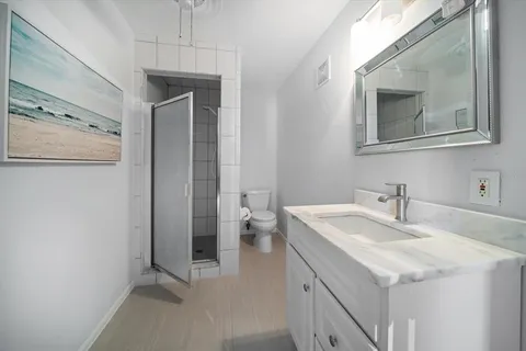 a living room with furniture and flowers