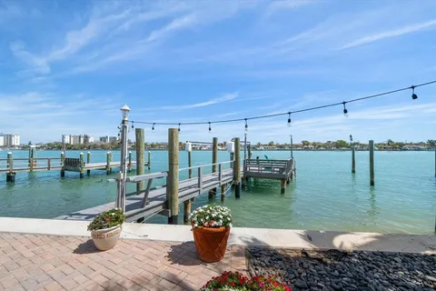 a view of house with a swimming pool and furniture