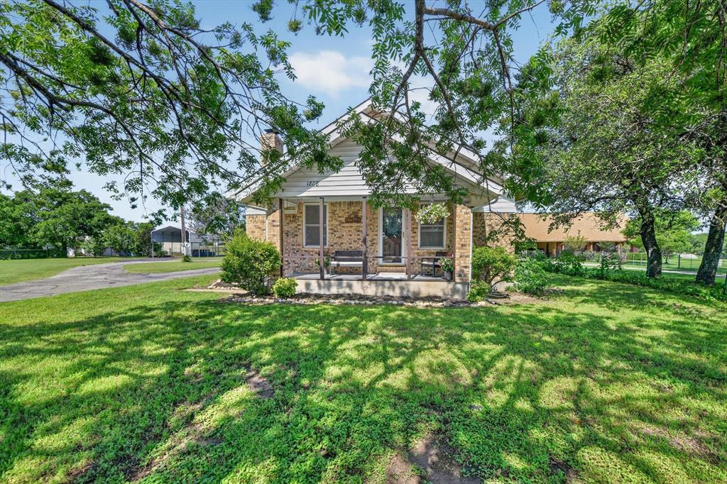 1808 Silver Creek Azle Road Azle, TX 76020 - Photo 3 of 32 a front view of a house with garden