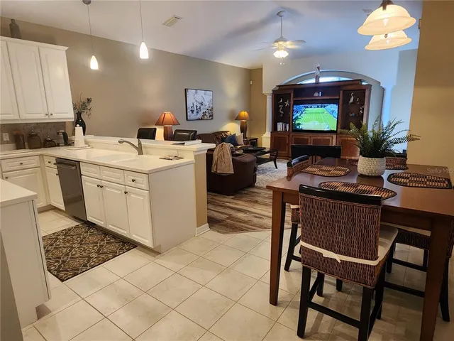 a room with a workspace and a flat screen tv