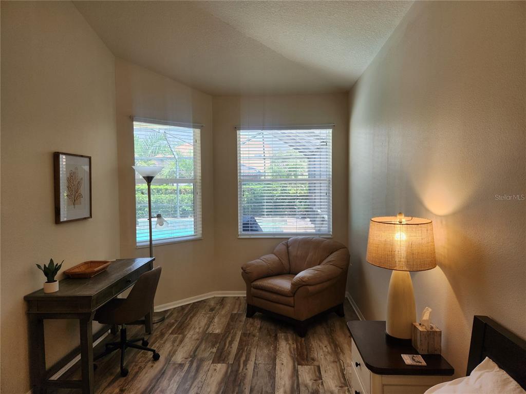 6496 Rookery Circle Bradenton, FL 34203 - Photo 19 of 40 a living room with furniture and a window