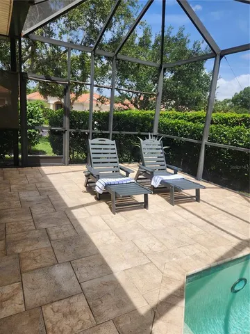 a view of backyard with sitting area