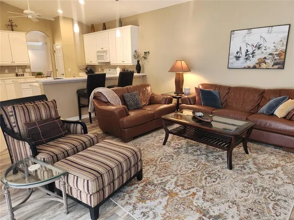 a living room with furniture or lamp and a rug