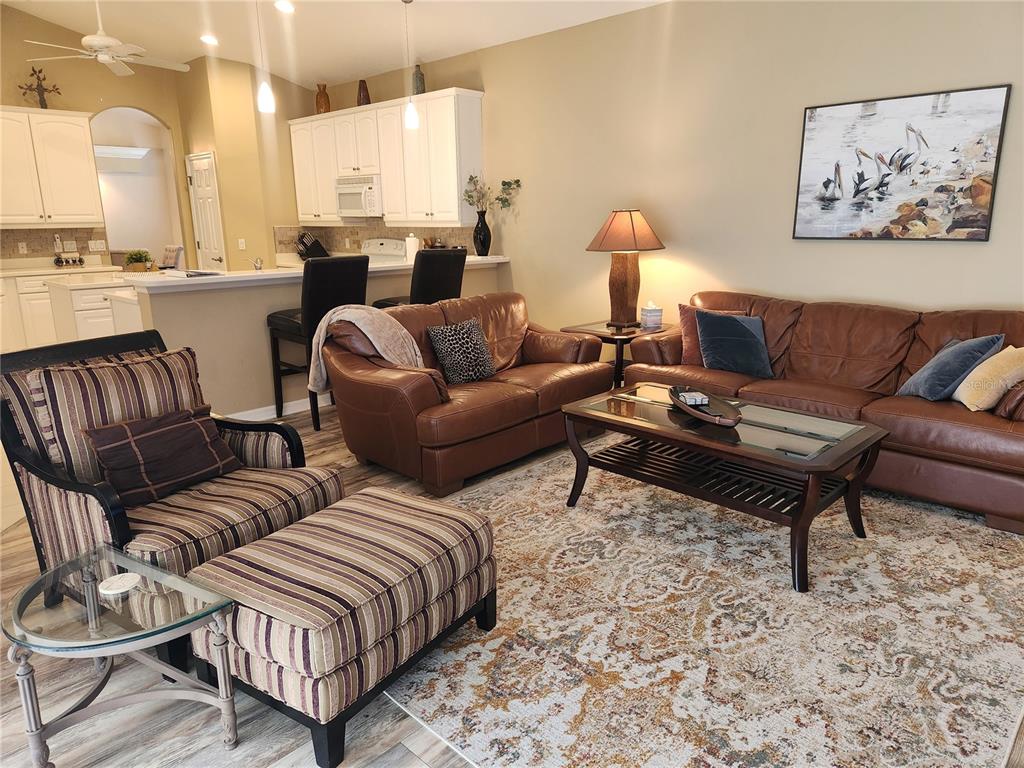 6496 Rookery Circle Bradenton, FL 34203 - Photo 9 of 40 a living room with furniture or lamp and a rug