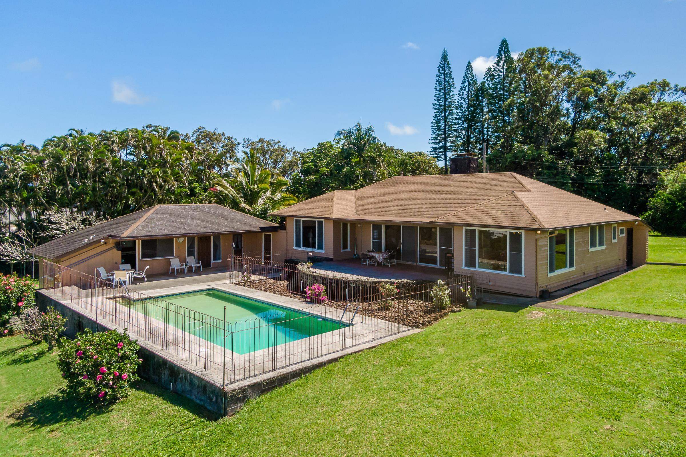 1860 Haiku Road Haiku, HI 96708 - Photo 1 of 2 a view of a house with swimming pool and sitting area