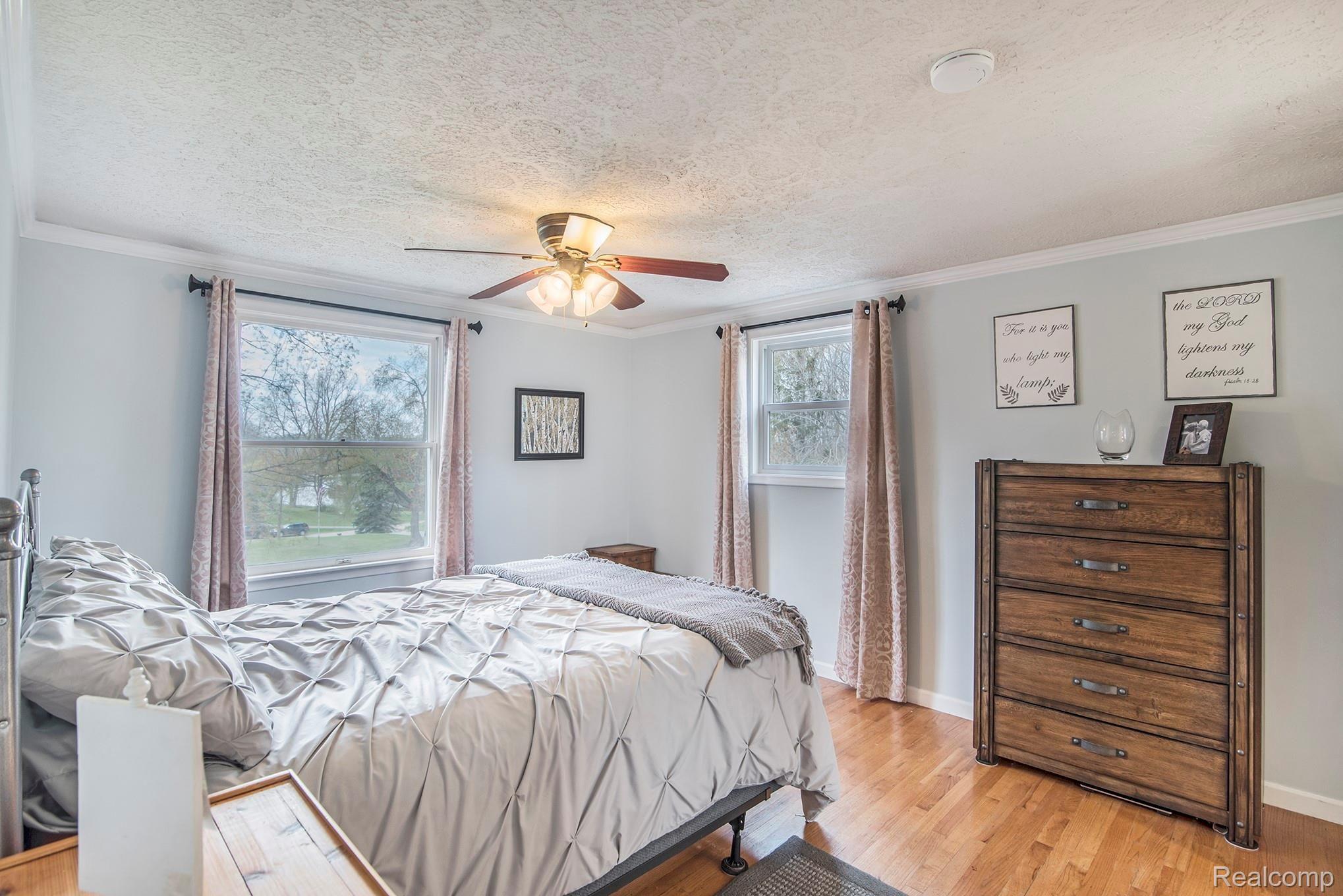 1860 Echo Hills Road Howell, MI 48855 - Photo 10 of 25 Master bedroom with hardwood flooring