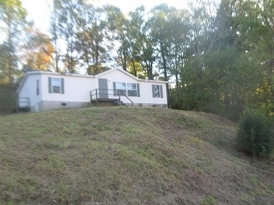 549 Wiggins Road Tellico Plains, TN 37385 - Photo 1 of 1 a view of a house with a yard
