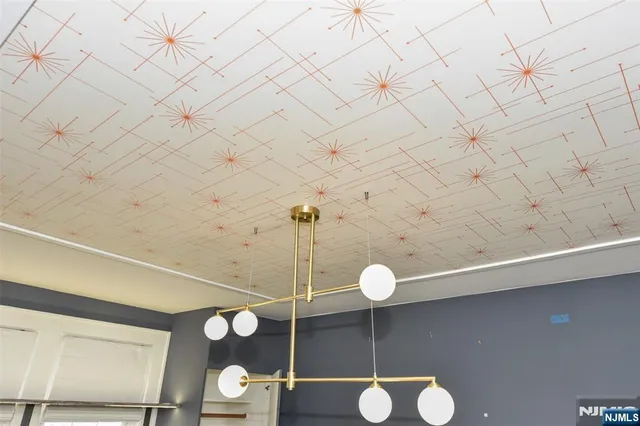 a kitchen with granite countertop a sink a stove and cabinets