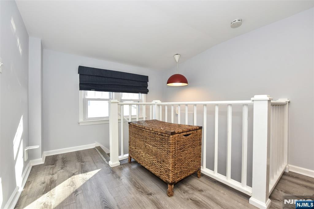 12-64 Burbank Street Fair Lawn, NJ 07410 - Photo 21 of 34 a living room with furniture and a window