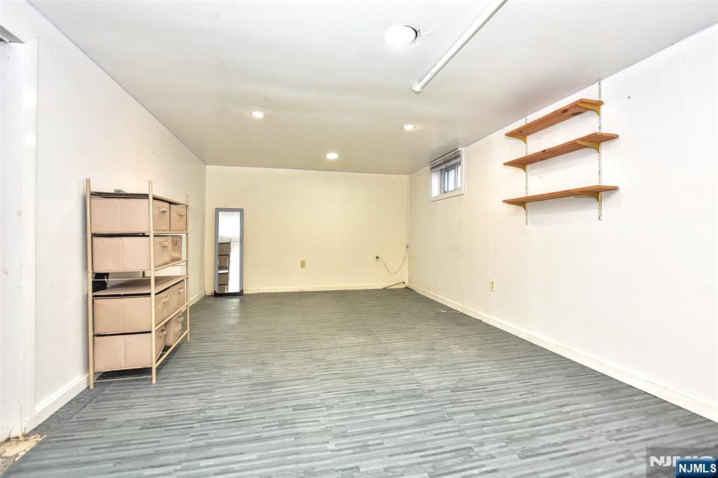12-64 Burbank Street Fair Lawn, NJ 07410 - Photo 25 of 34 a view of a kitchen with wooden floor and electronic appliances
