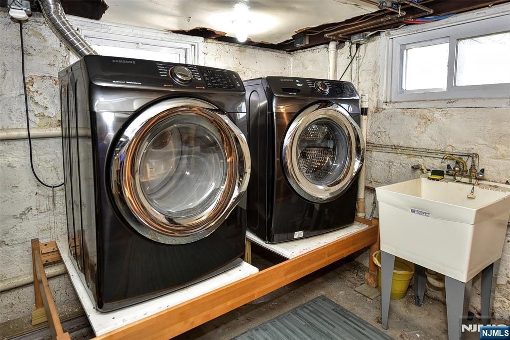 12-64 Burbank Street Fair Lawn, NJ 07410 - Photo 27 of 34 a utility room with dryer and washer