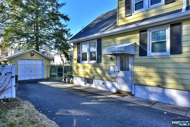 a view of a small house with a outdoor space