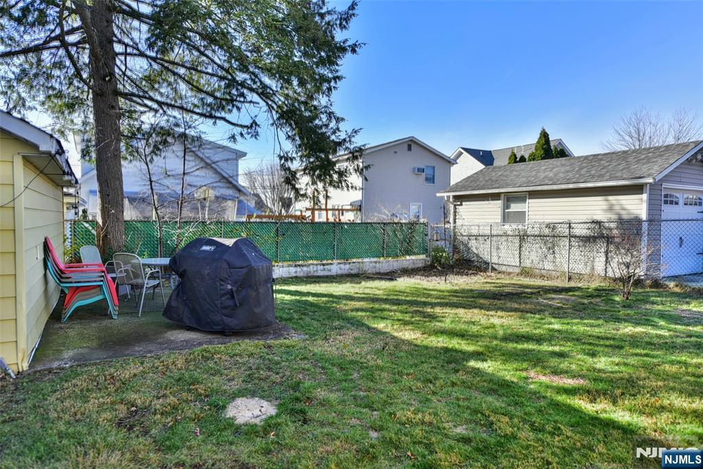 12-64 Burbank Street Fair Lawn, NJ 07410 - Photo 31 of 34 a view of a house with a backyard