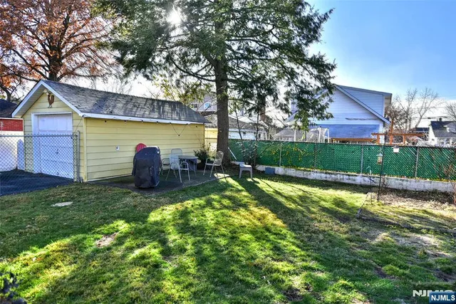 a view of house with a yard